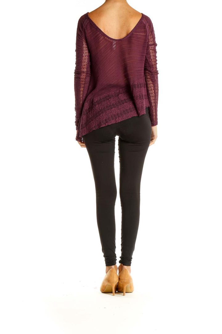 Back view of burgundy Free People top showing lace sleeves and asymmetrical design