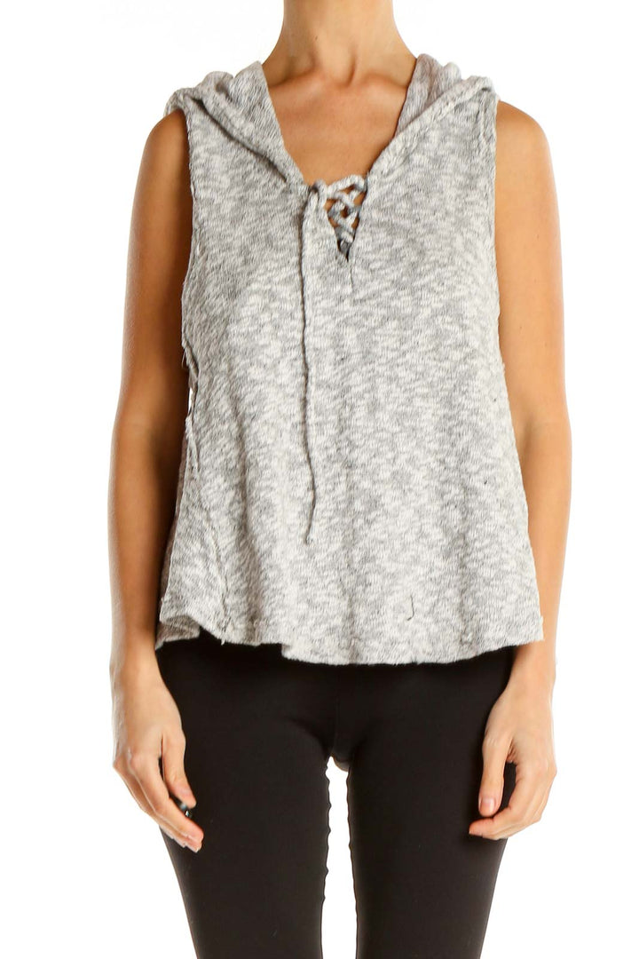 Front view of Free People gray sleeveless hooded top with lace-up neckline