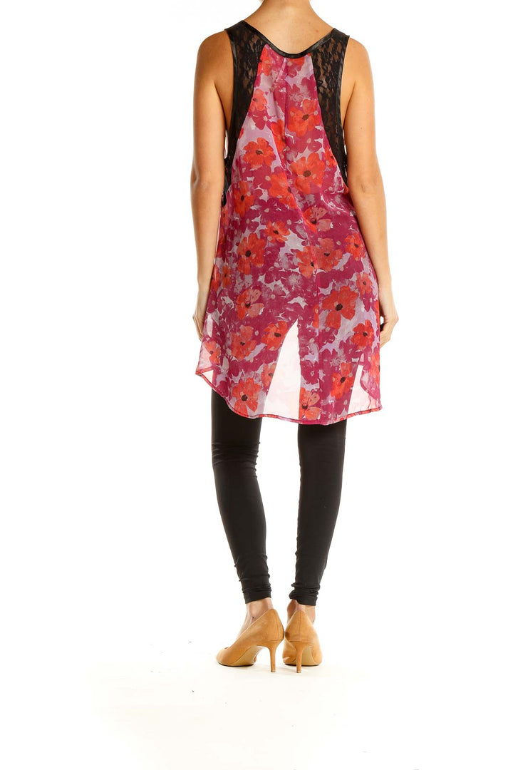 Back view of Free People red floral high-low tank top showing longer hem