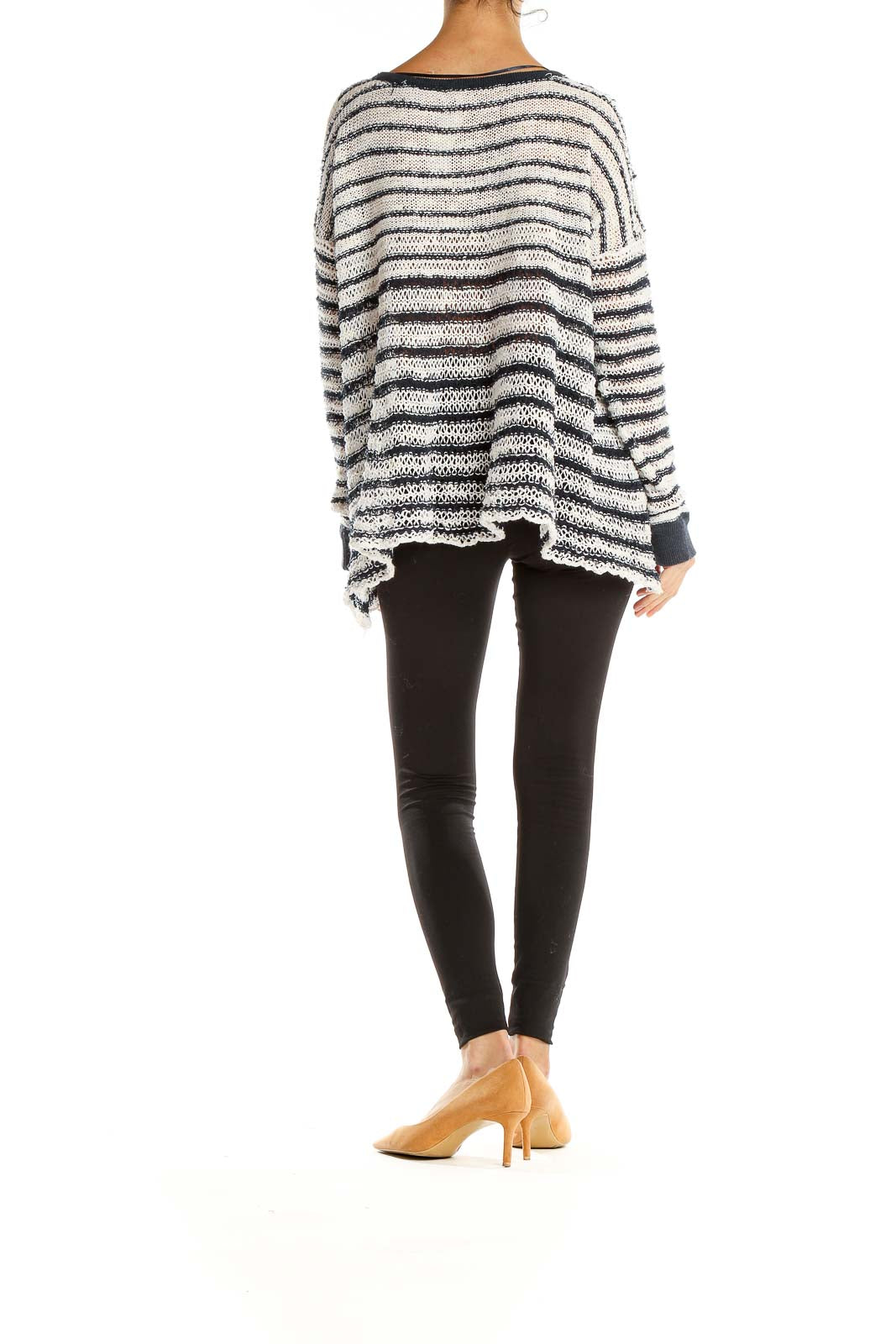 Back view of Free People white and black striped oversized knit sweater showing relaxed fit