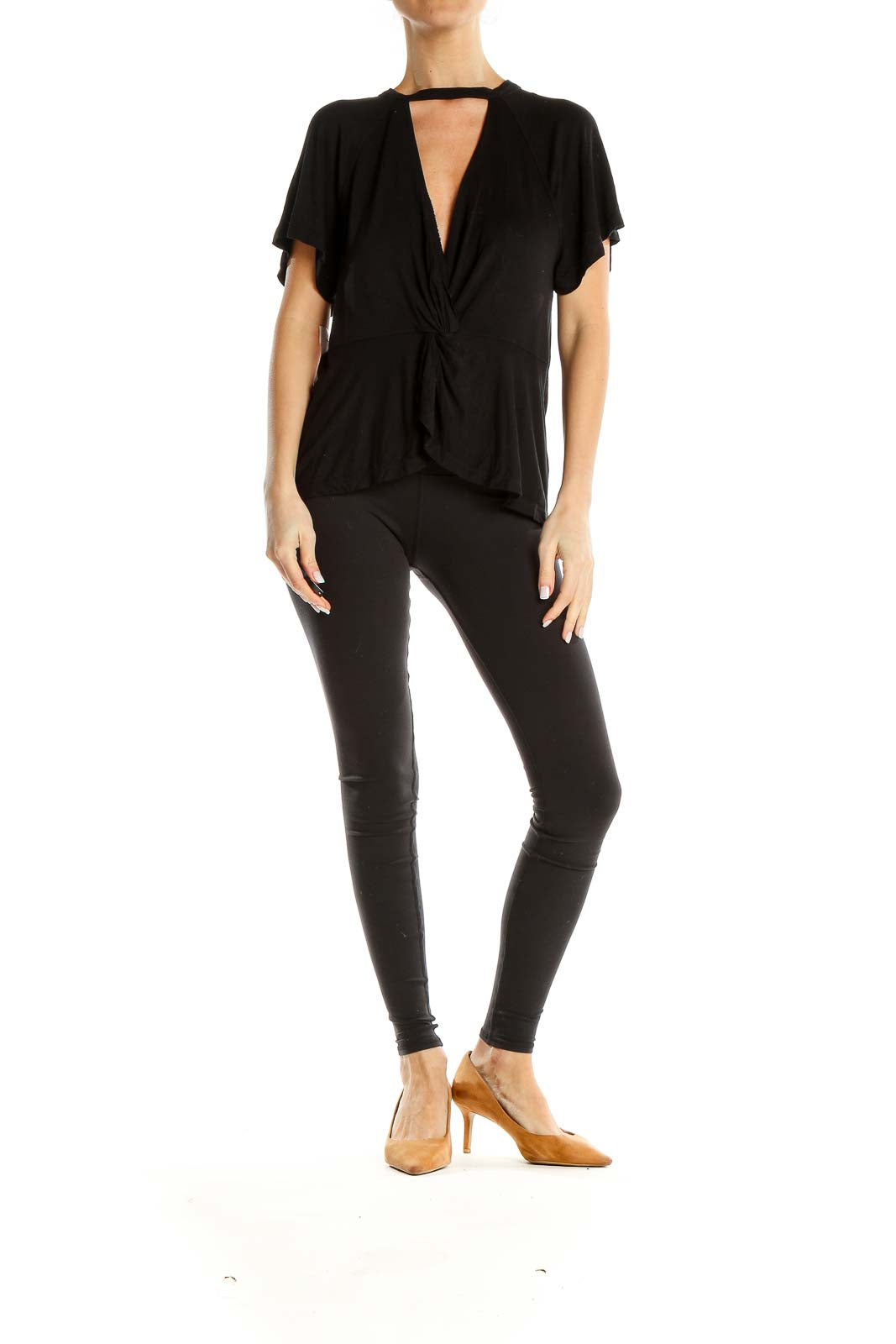 Front view of black Free People top with twist-front design and cutout detail