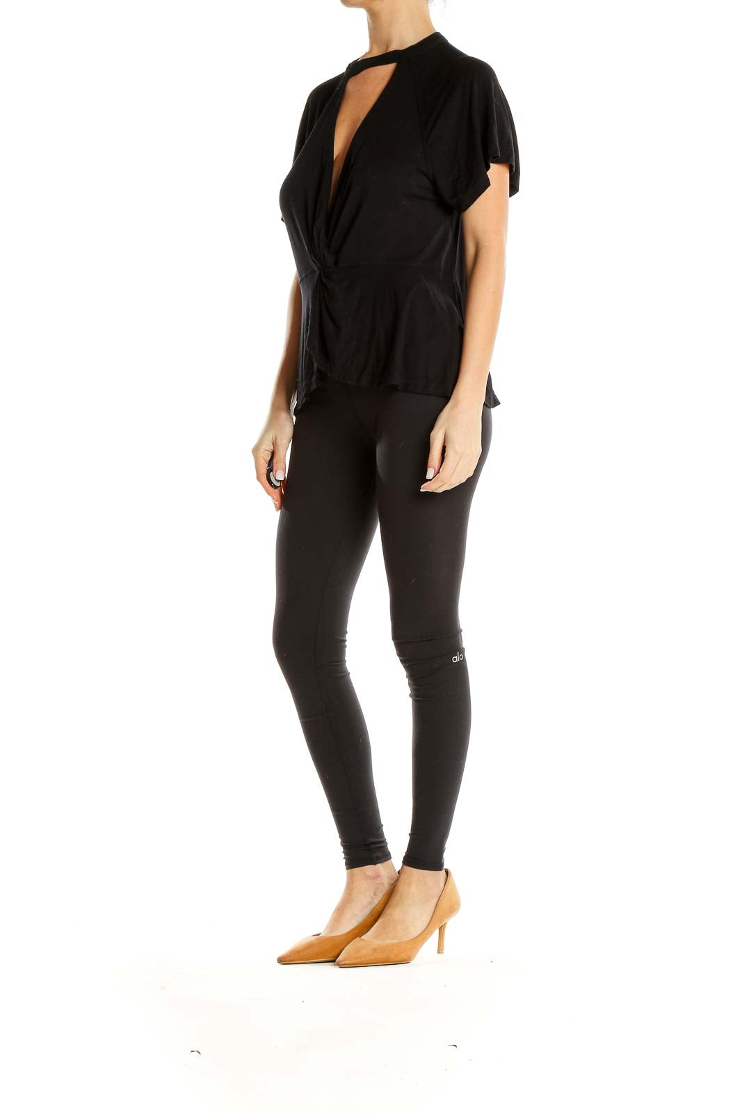 Front view of black Free People top with twist-front design and cutout detail