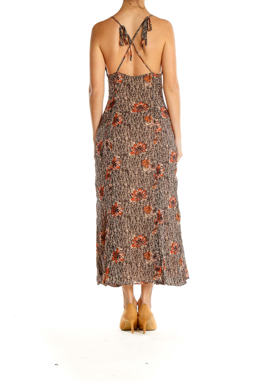 Back view of Free People brown floral maxi dress showing crisscross straps and tassel ties