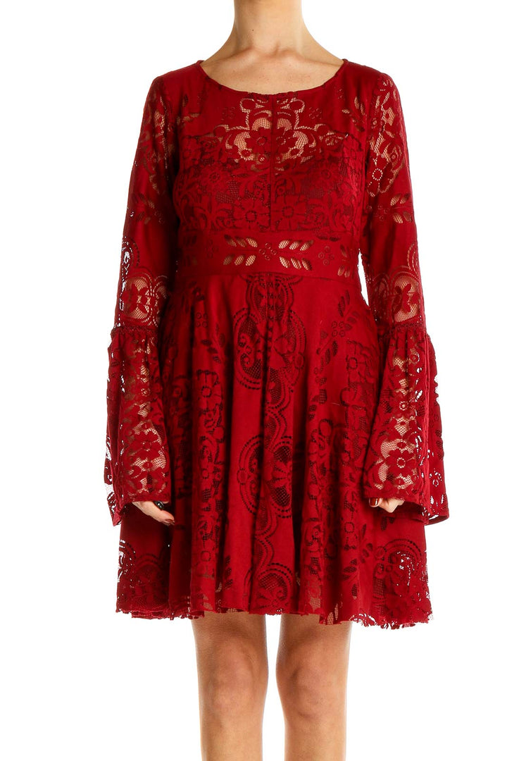 Front view of Free People red lace mini dress with bell sleeves