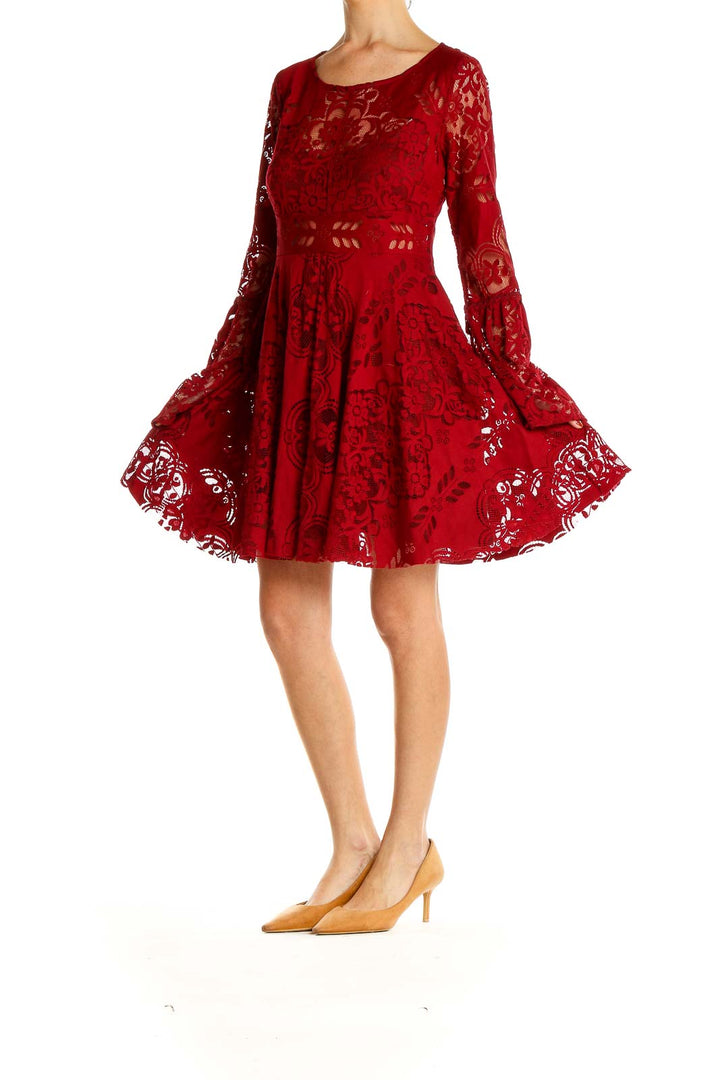 Front view of Free People red lace mini dress with bell sleeves