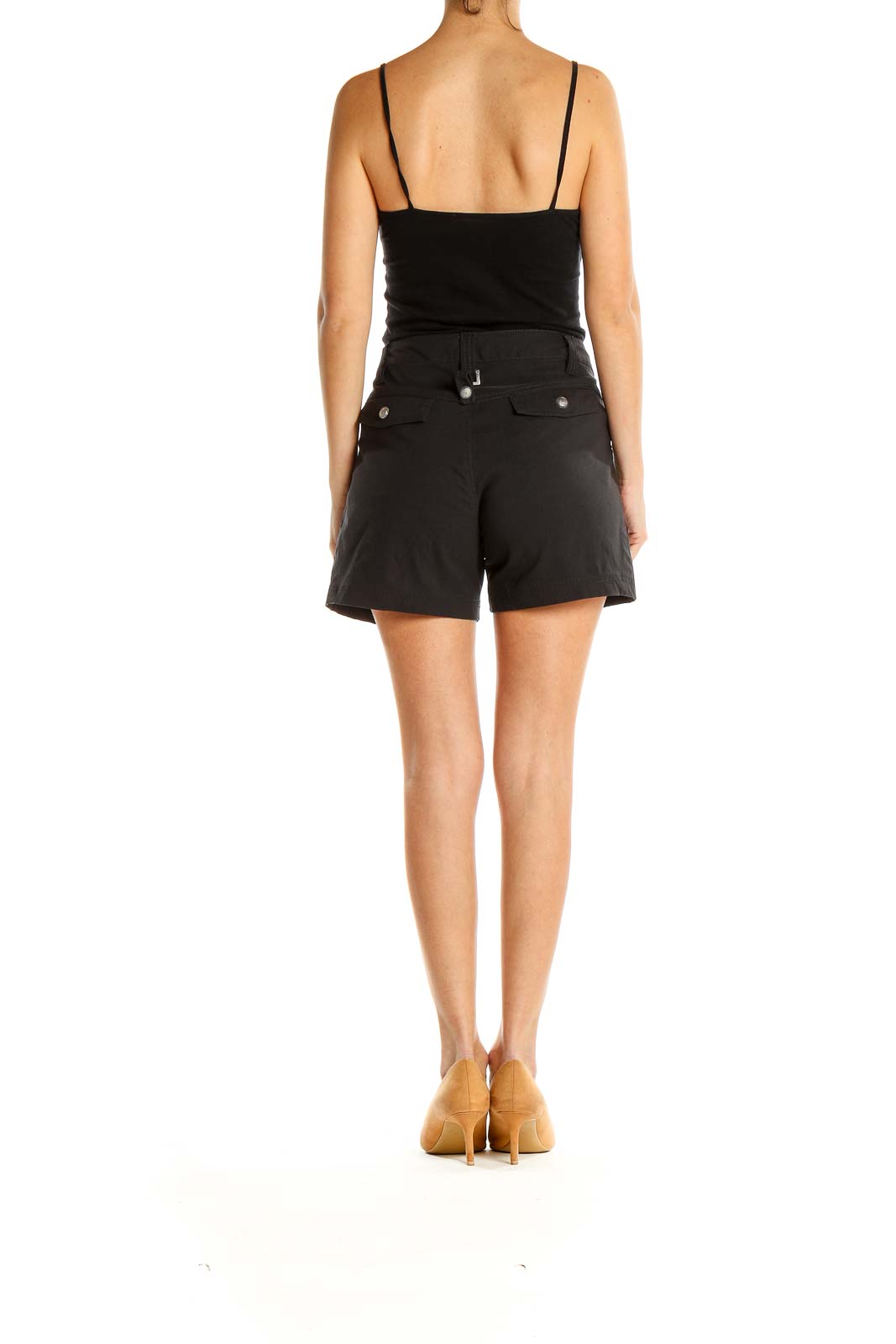 Side view of woman wearing black Athleta athletic shorts