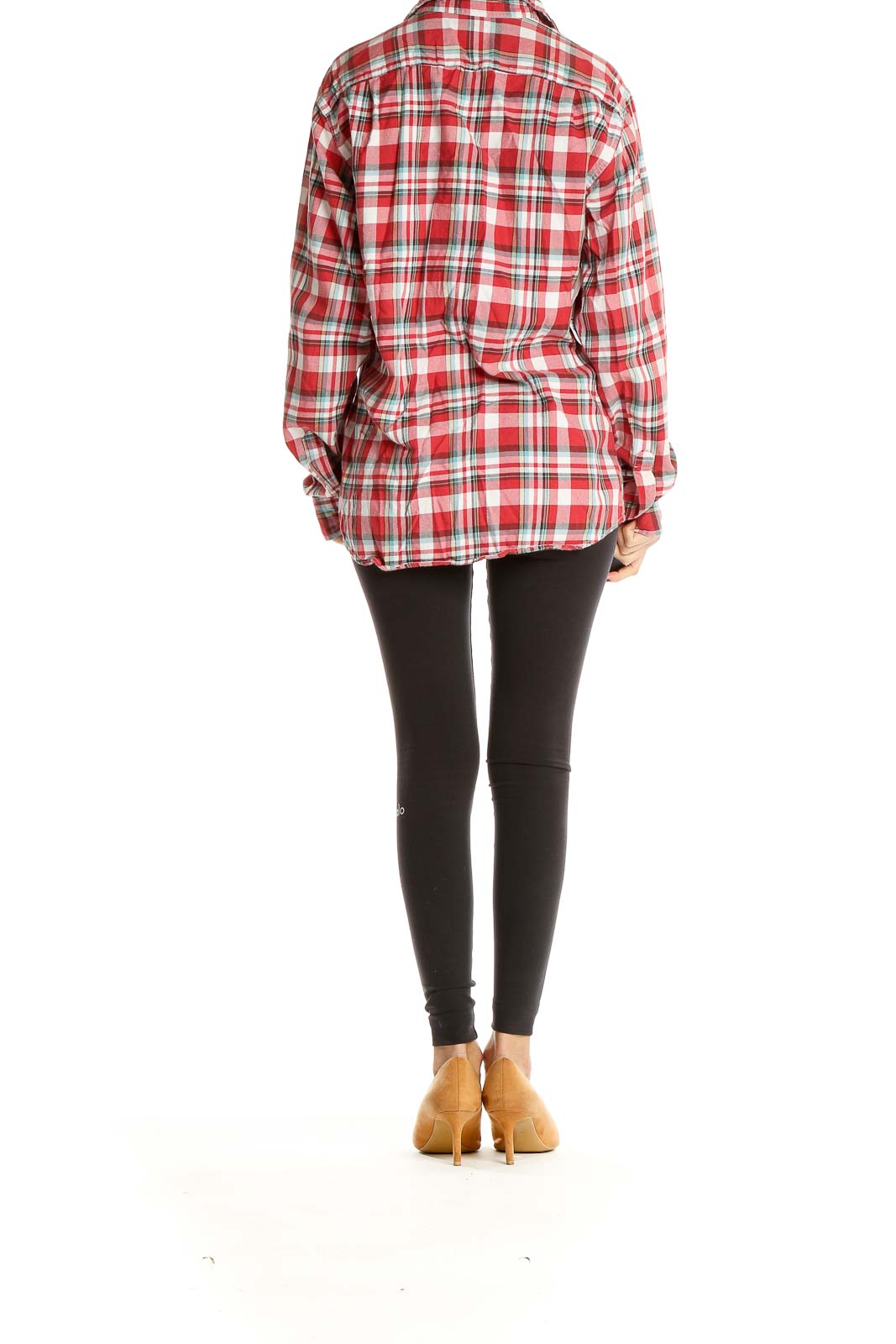 Side view of model wearing J.Crew red plaid button-up shirt with black leggings