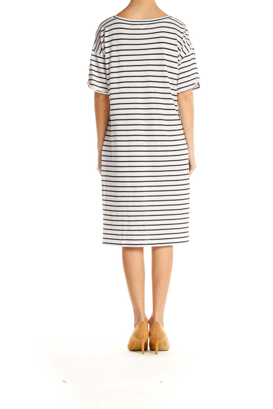 Side view of J.Crew white and black striped t-shirt dress on model