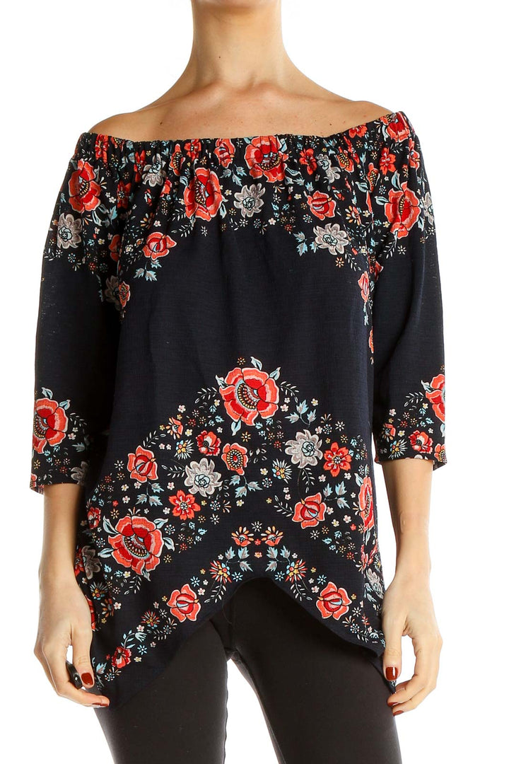 Front view of ECI black off-shoulder top with red floral print