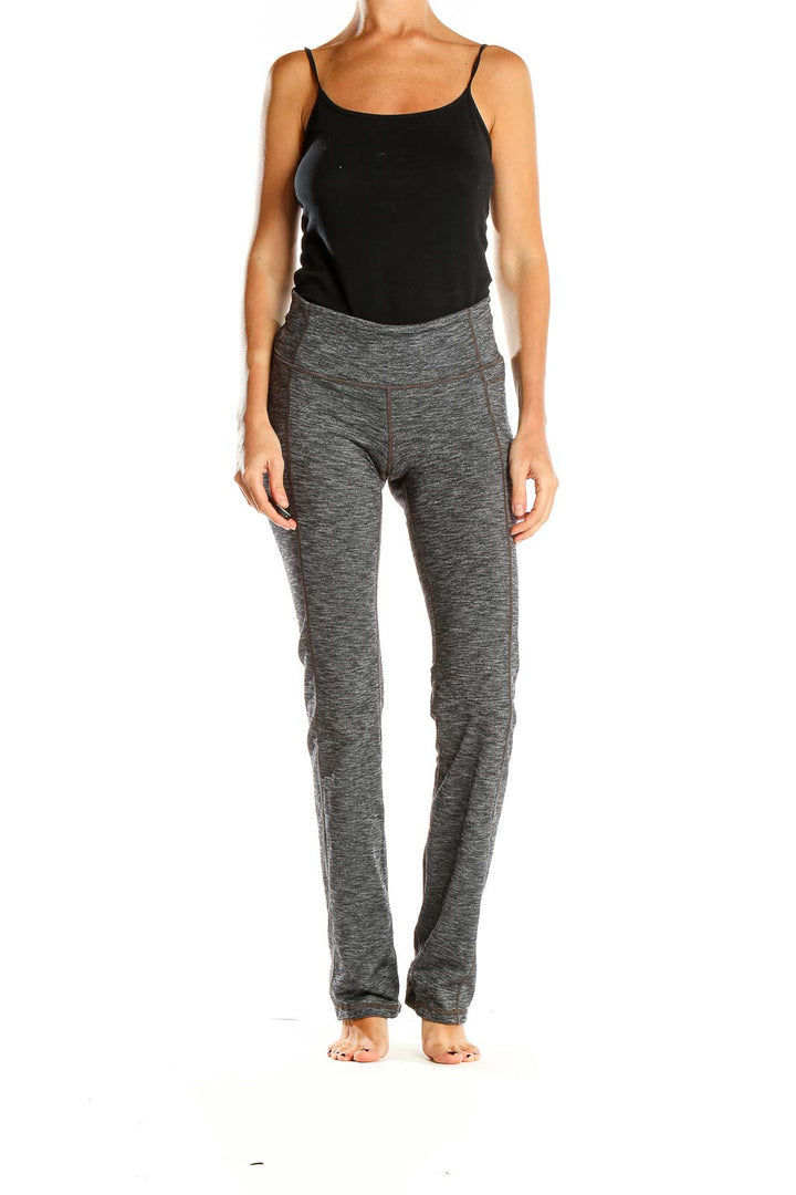 Front view of Athleta gray heathered yoga pants on model