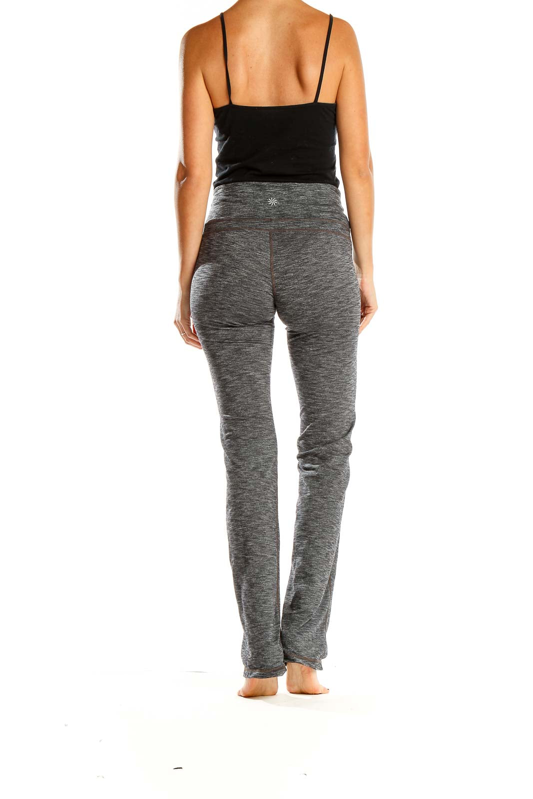 Side view of Athleta gray heathered yoga pants on model