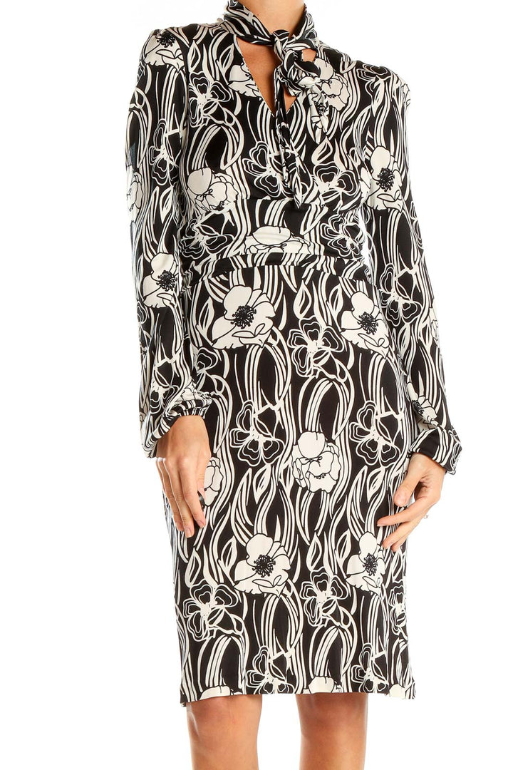 Front view of Banana Republic black and white floral print silk dress with tie neck detail