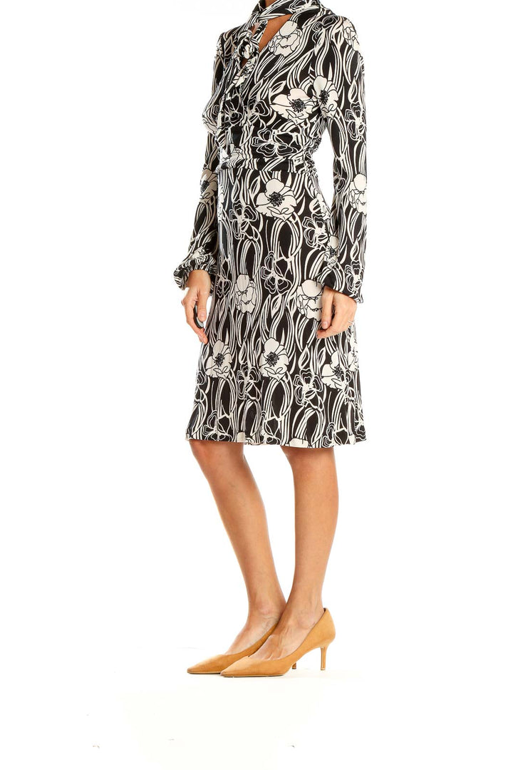 Front view of Banana Republic black and white floral print silk dress with tie neck detail