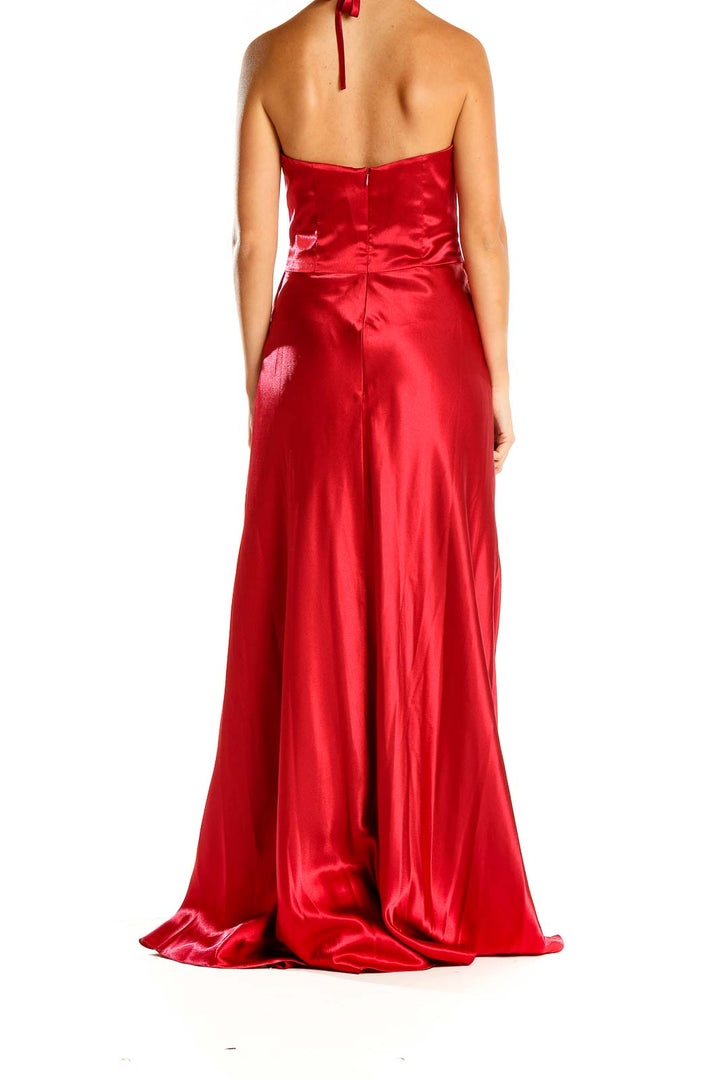 Back view of red satin halter maxi dress showing backless design