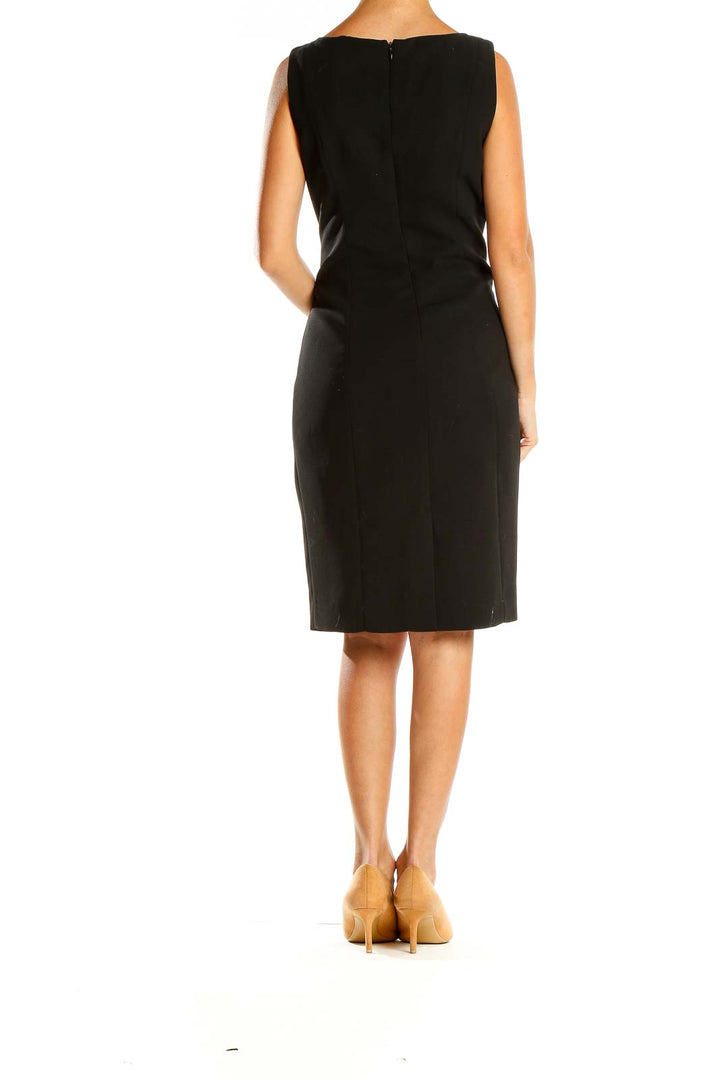 Back view of Calvin Klein black sleeveless sheath dress showing clean design