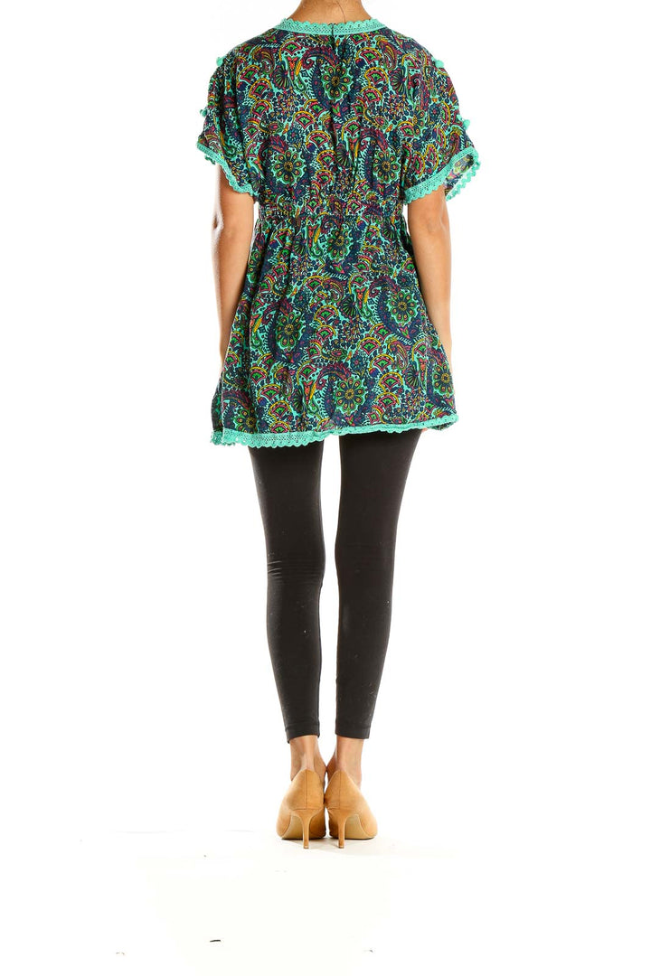 Back view of teal paisley tunic top showing flowy silhouette