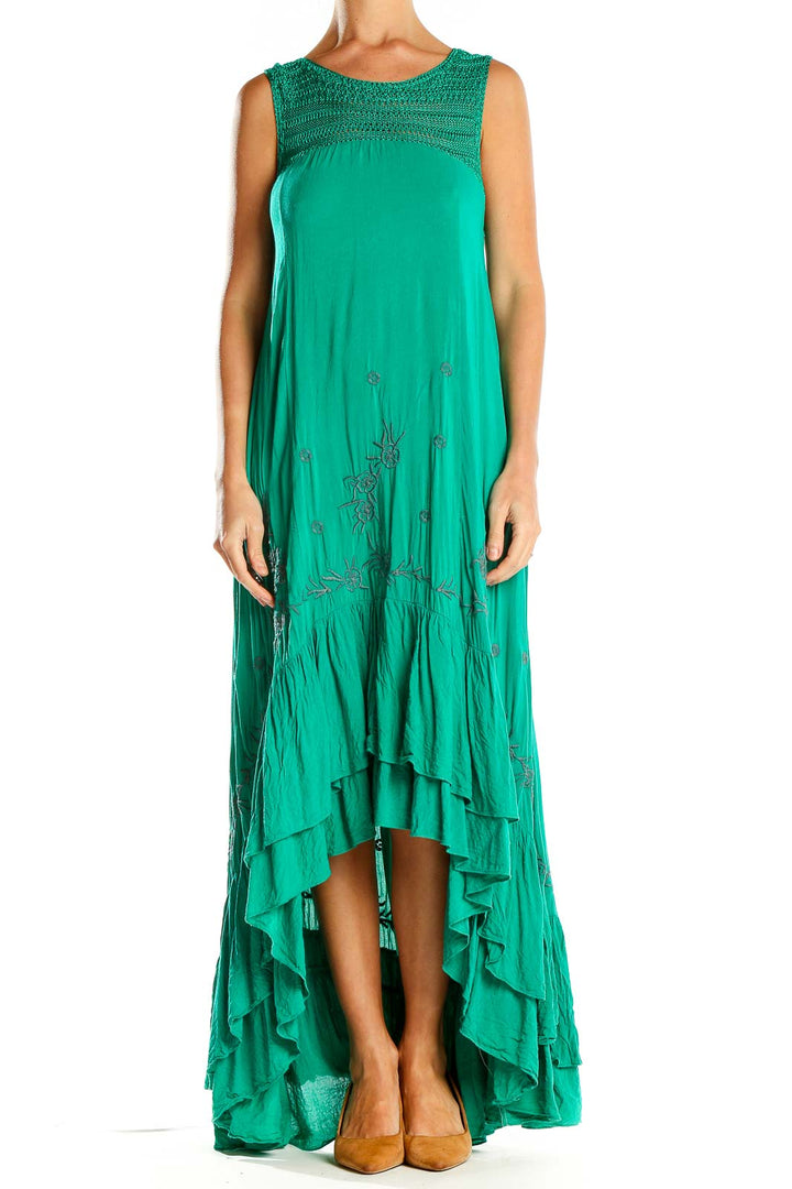 Front view of green Free People maxi dress with embroidered yoke and high-low hem