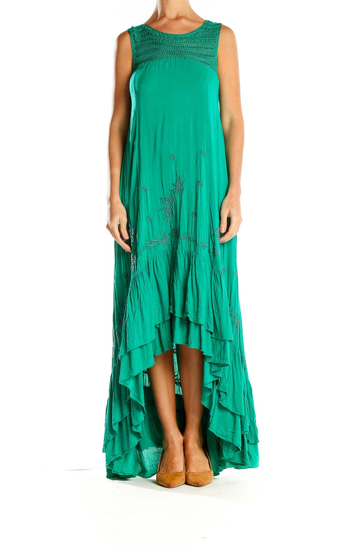 Front view of green Free People maxi dress with embroidered yoke and high-low hem