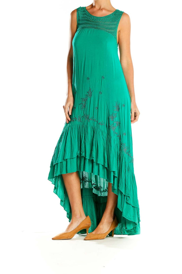 Front view of green Free People maxi dress with embroidered yoke and high-low hem