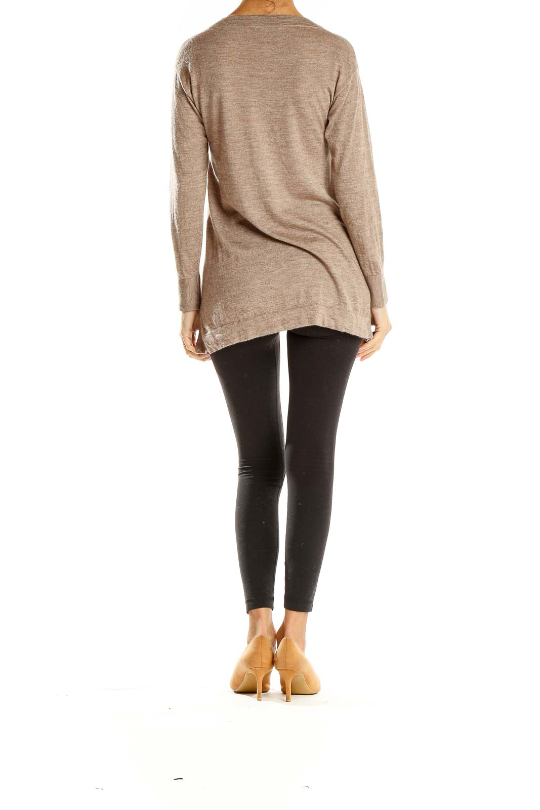 Side view of beige Rani Arabella long sleeve sweater with black leggings