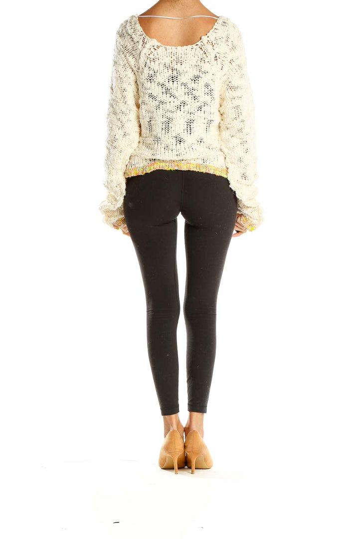 Back view of Free People cream cropped knit sweater with colorful trim