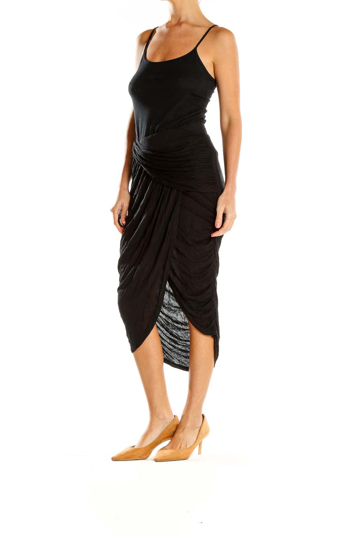 Front view of Free People black draped midi skirt with wrap-style design