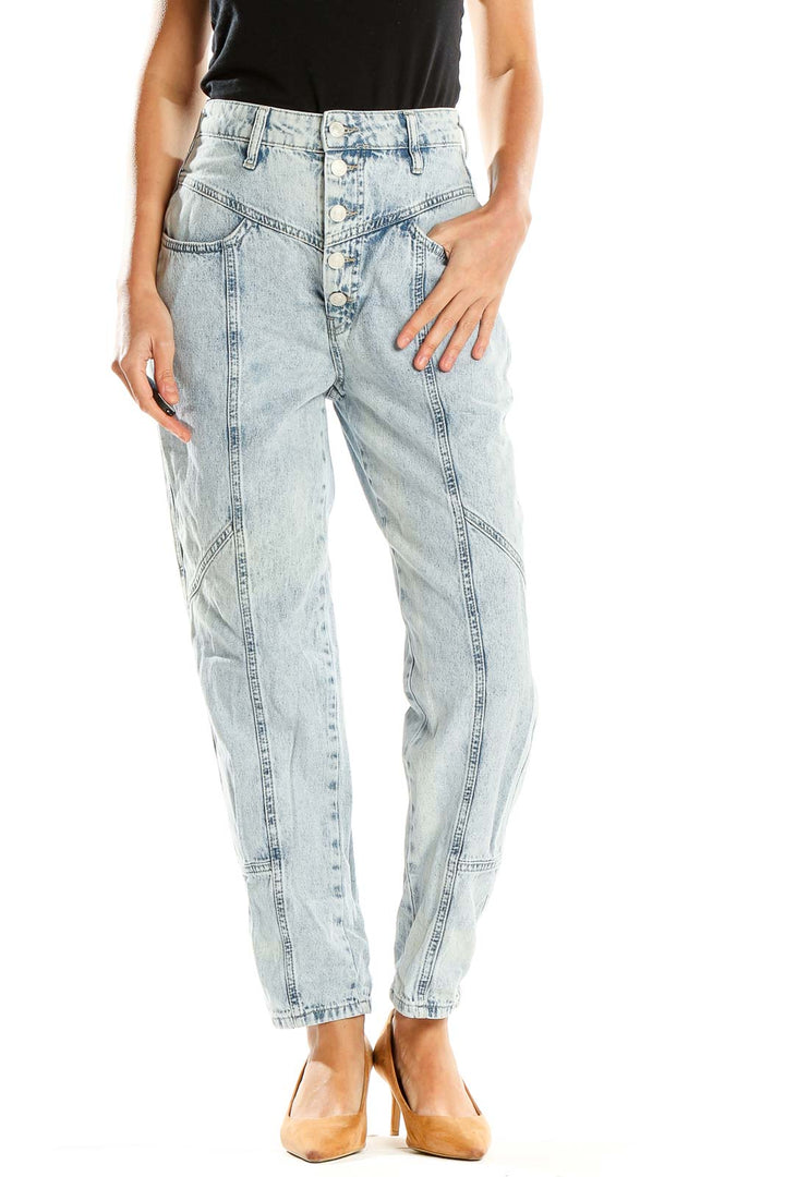 Front view of Free People light blue acid wash high-waisted jeans with paneled design