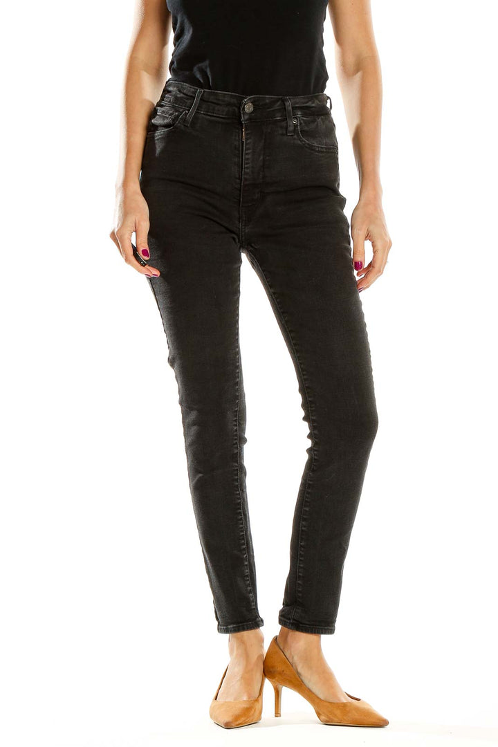 Front view of Levi's black high-waisted skinny jeans on model