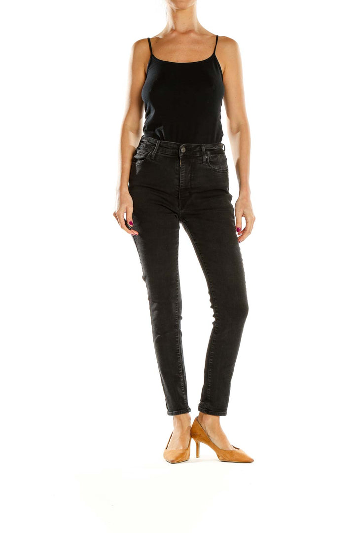 Front view of Levi's black high-waisted skinny jeans on model