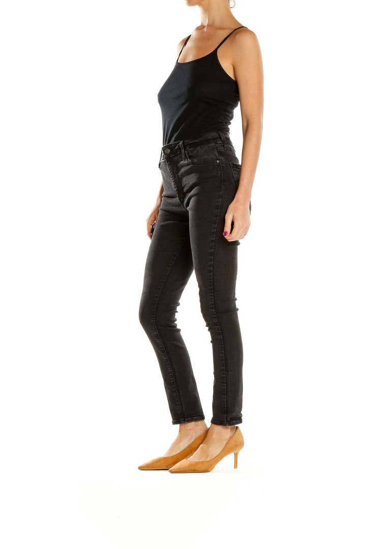 Front view of Levi's black high-waisted skinny jeans on model