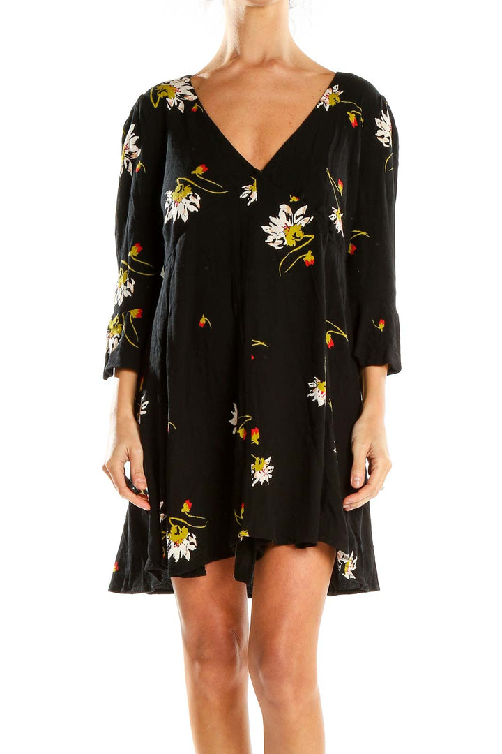 Front view of Free People black floral mini dress with V-neck