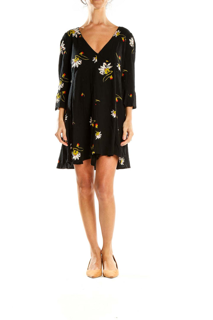 Front view of Free People black floral mini dress with V-neck