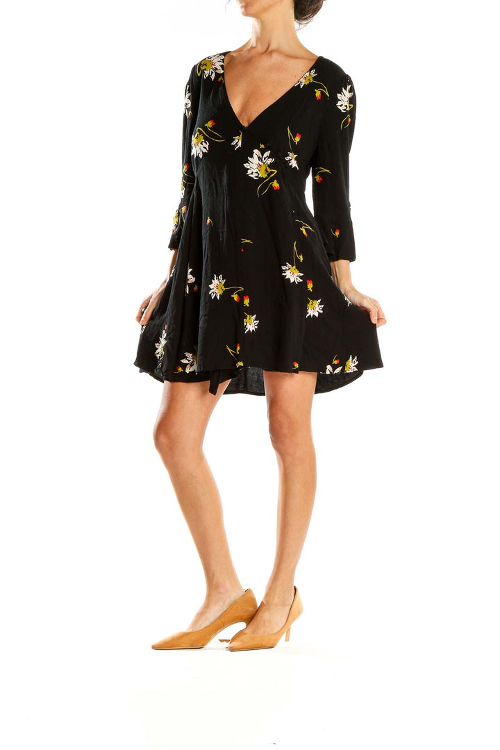 Front view of Free People black floral mini dress with V-neck