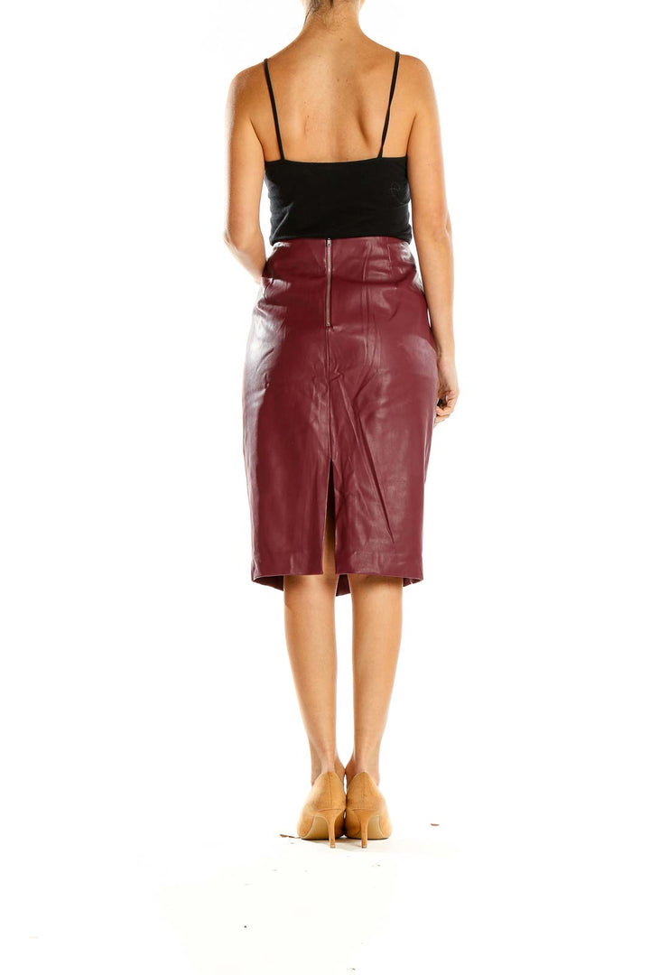 Side view of Belle + Sky burgundy faux leather pencil skirt on model