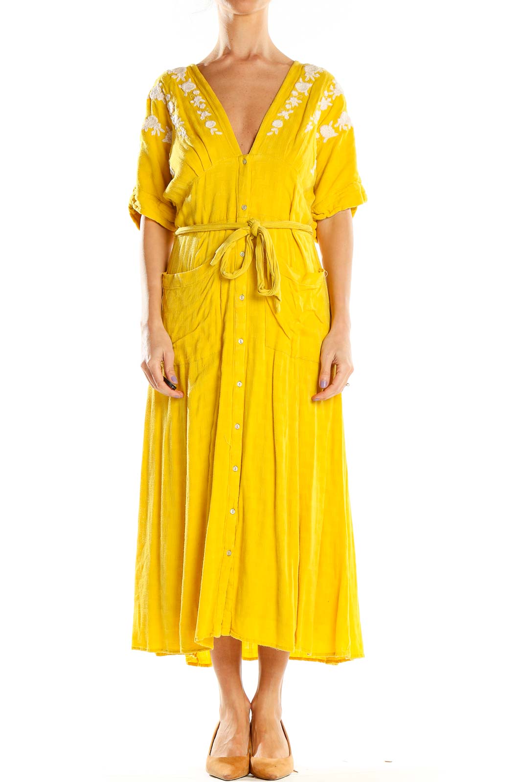 Front view of Free People yellow embroidered maxi dress with V-neckline and tie belt