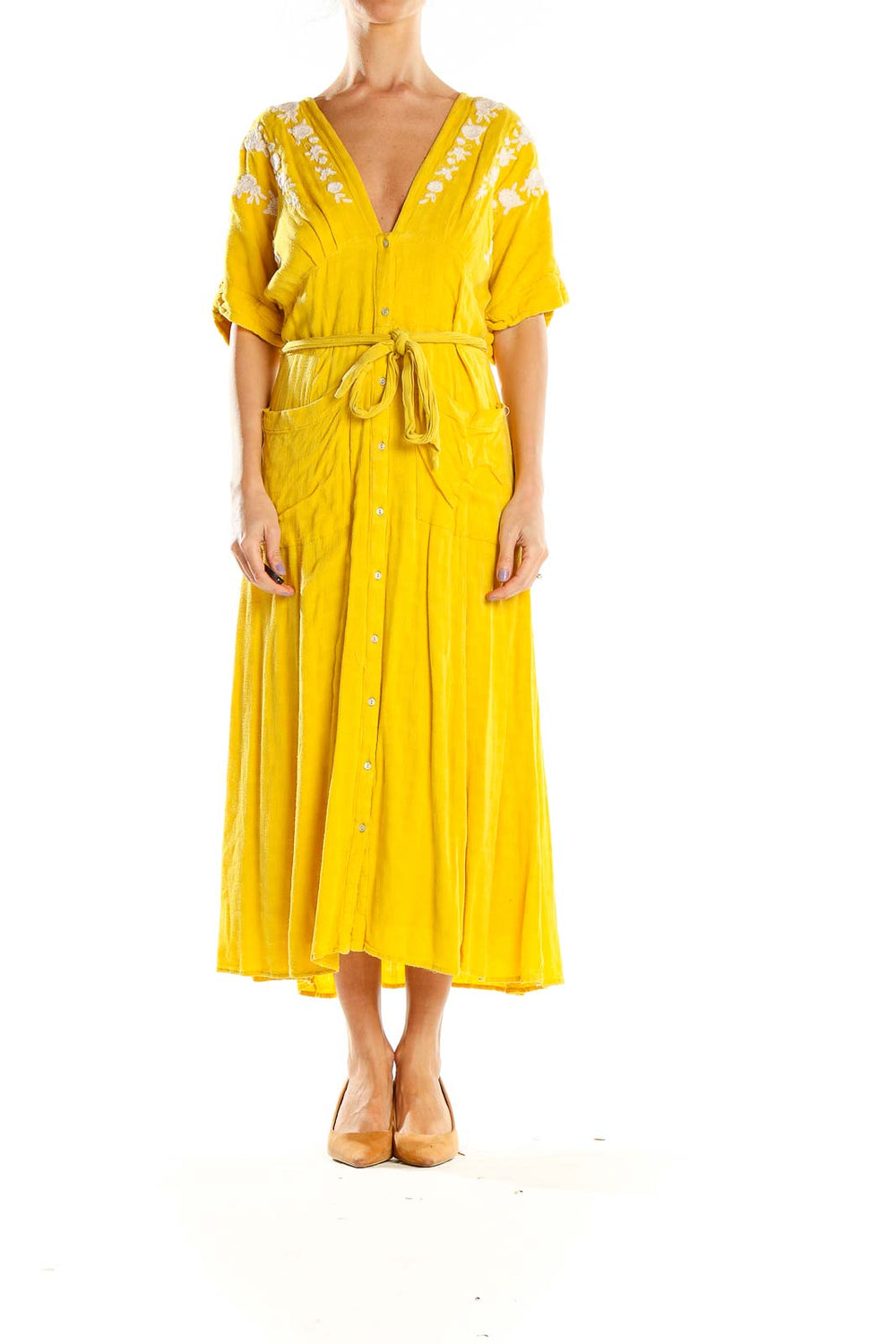 Front view of Free People yellow embroidered maxi dress with V-neckline and tie belt