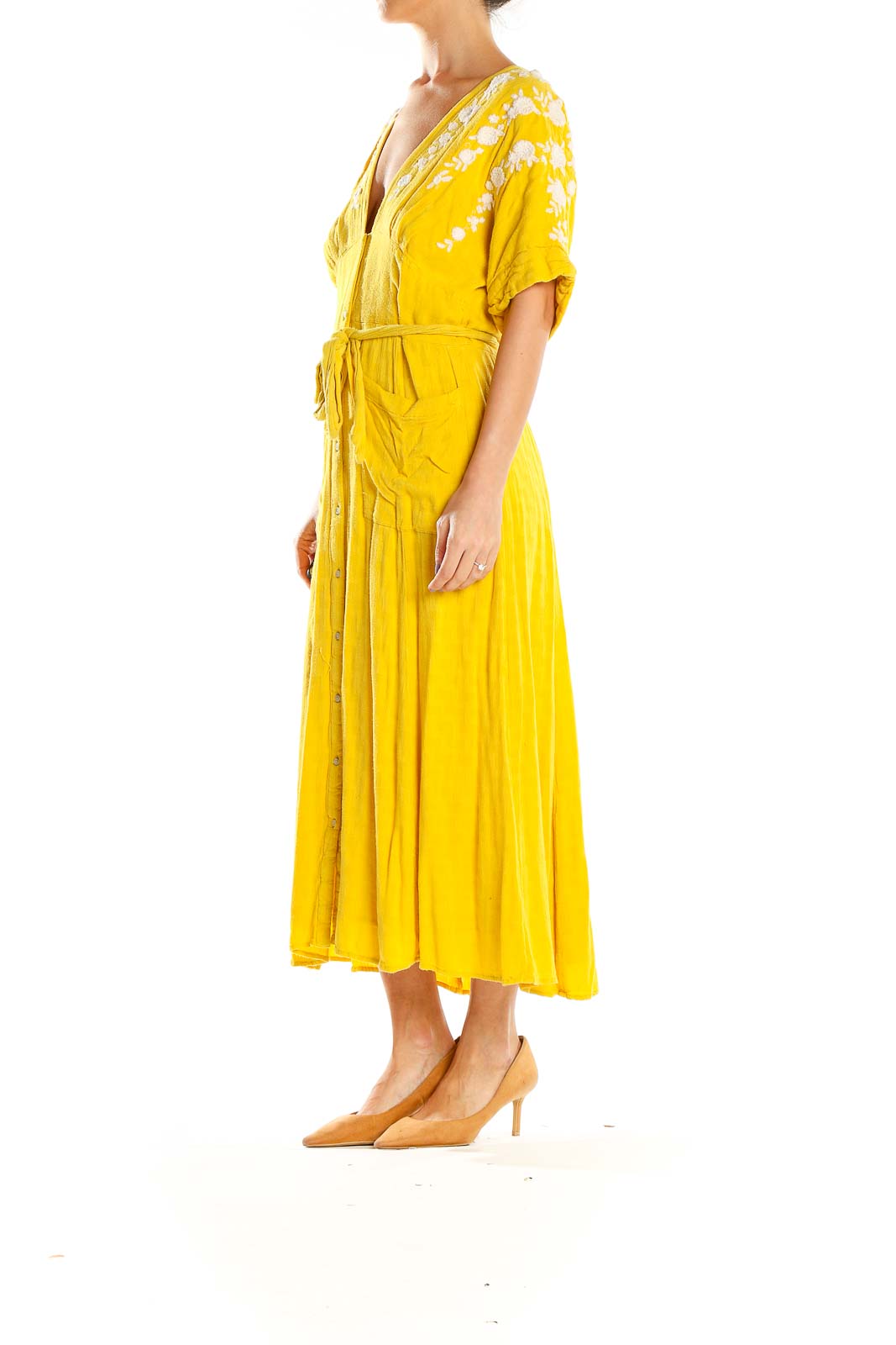 Front view of Free People yellow embroidered maxi dress with V-neckline and tie belt