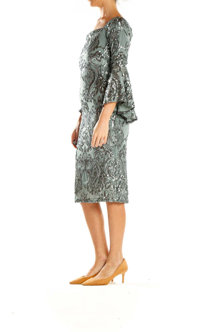 Front view of Betsy & Adam sage green sequined cocktail dress with bell sleeves