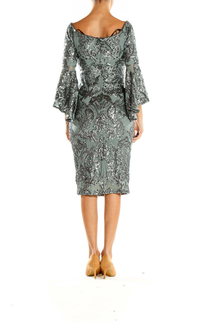 Side view of Betsy & Adam sage green sequined cocktail dress showing bell sleeve detail