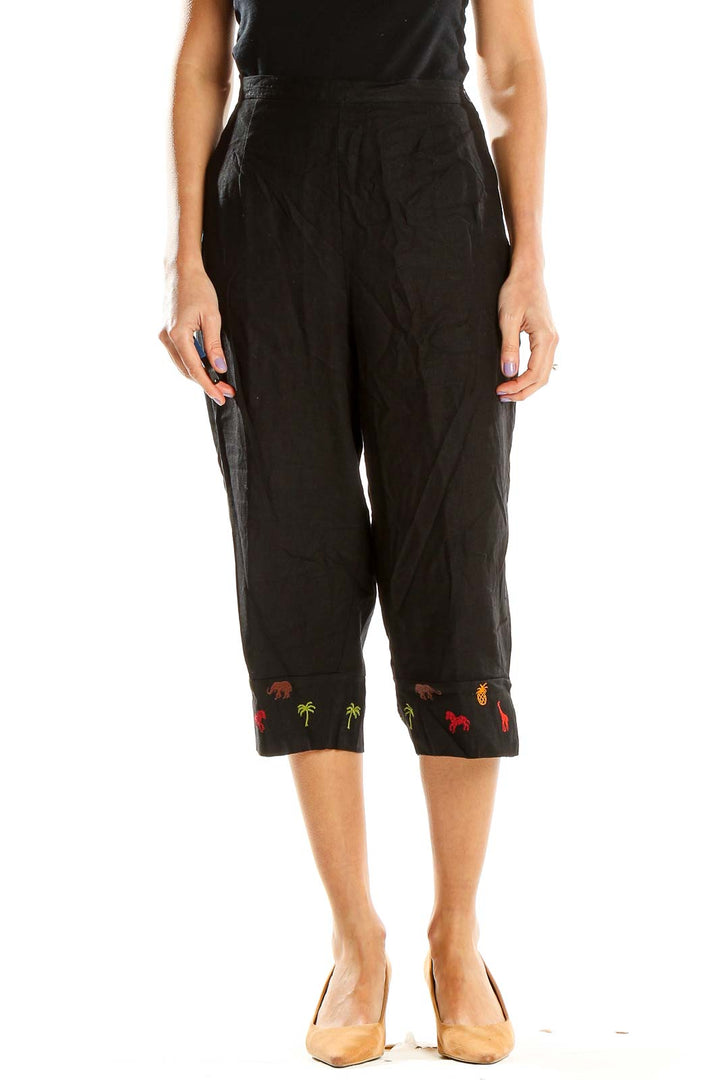 Front view of Studio Ease black capri pants with embroidered hem