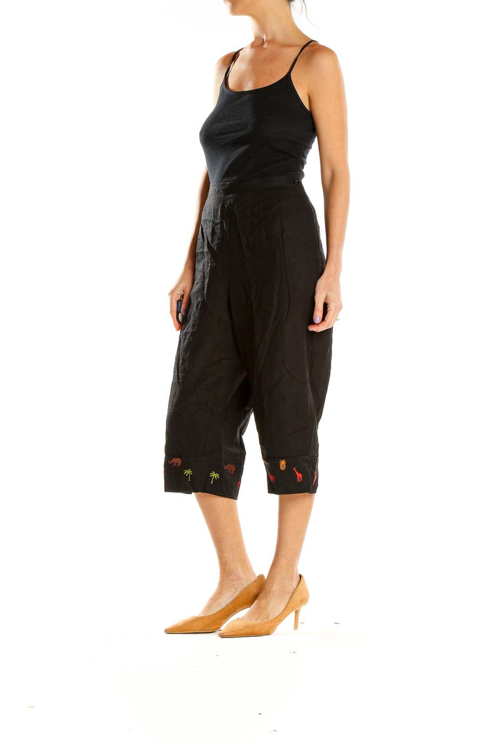 Front view of Studio Ease black capri pants with embroidered hem