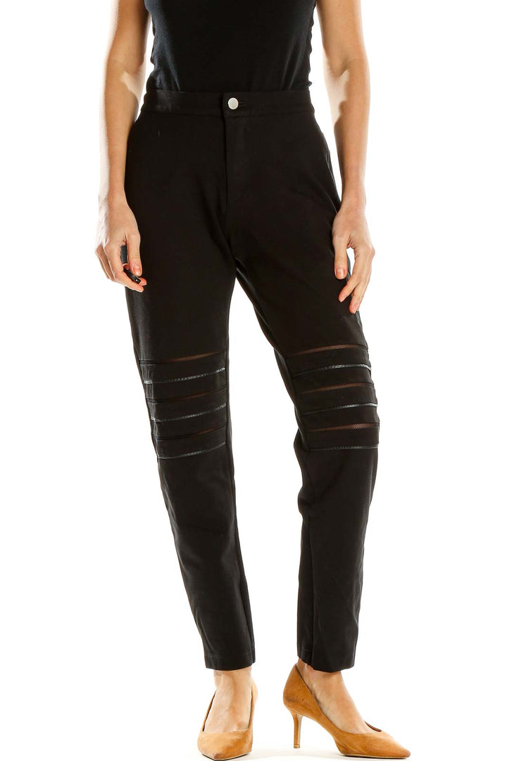 Front view of Tart black pants with mesh detailing on thighs