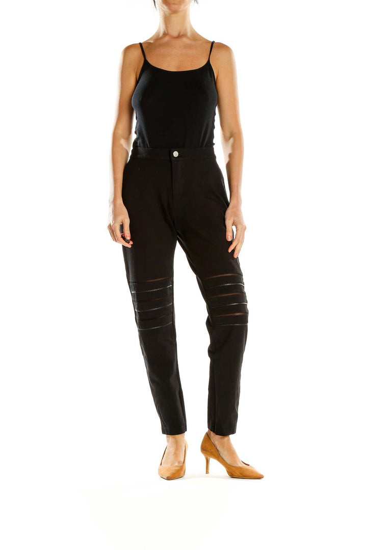 Front view of Tart black pants with mesh detailing on thighs