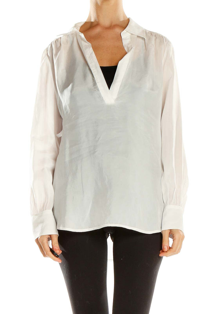 Front view of J.Crew white V-neck long sleeve blouse on model