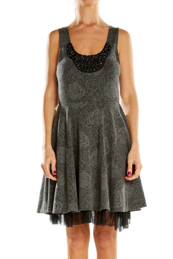 Front view of gray Free People fit-and-flare dress with embossed floral pattern and beaded neckline