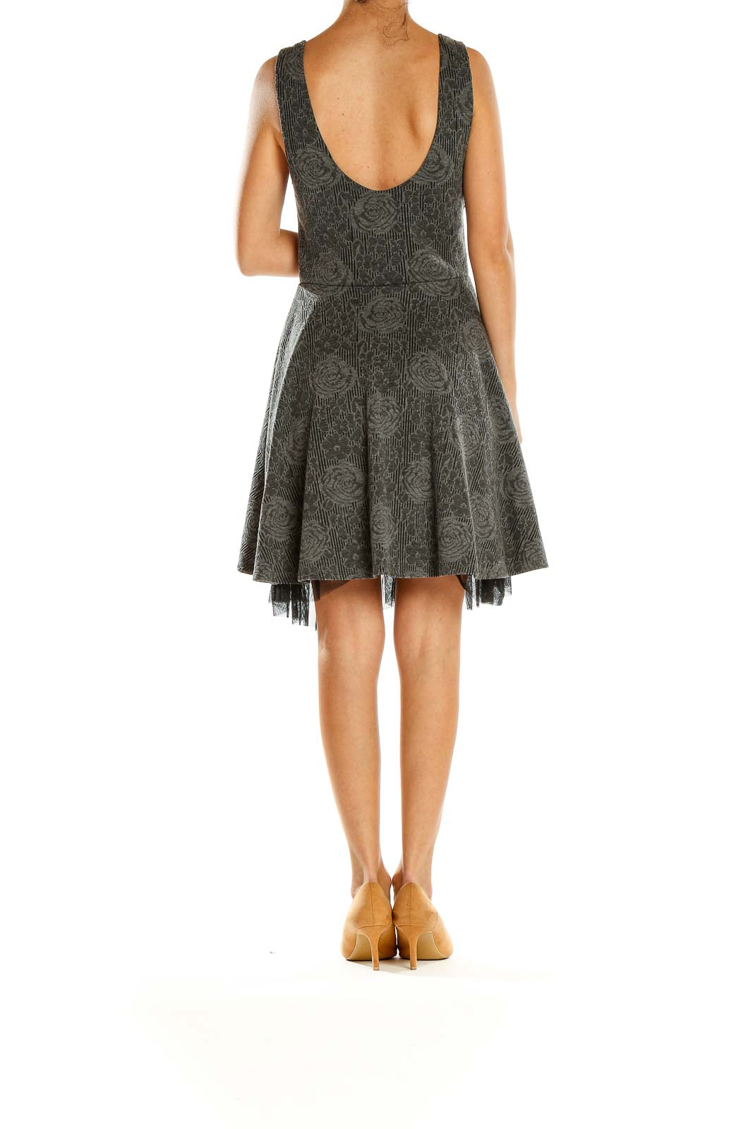 Back view of gray Free People fit-and-flare dress showing low scoop back and flared skirt with tulle hem