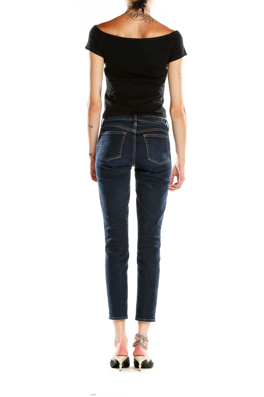 Side view of J.Crew dark blue slim fit cropped jeans on model