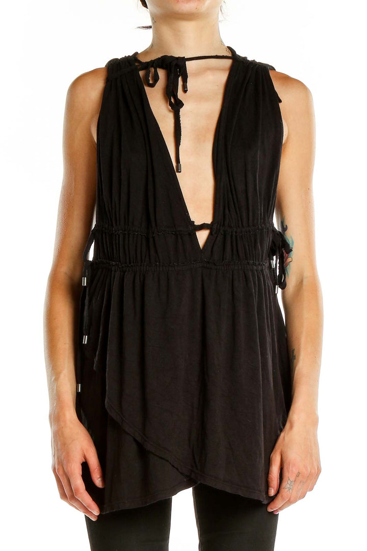 Front view of Free People black tunic top with plunging V-neck and gathered waist