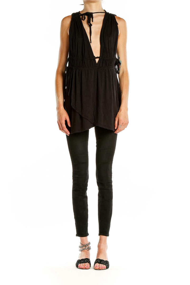 Front view of Free People black tunic top with plunging V-neck and gathered waist