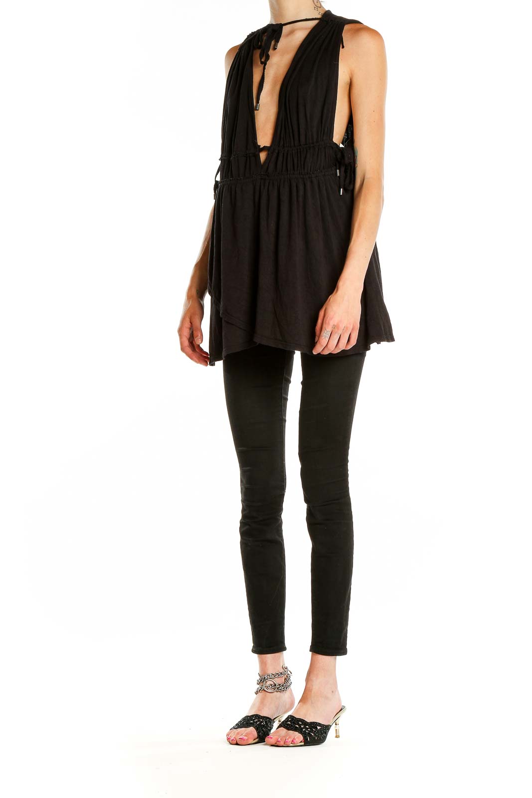 Front view of Free People black tunic top with plunging V-neck and gathered waist